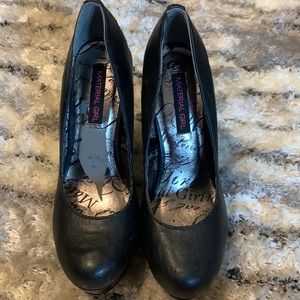 Black platform pumps